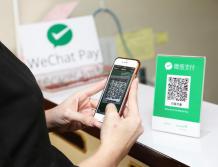 A Chinese tourist paying with WeChat Pay - China Elite Focusjpg